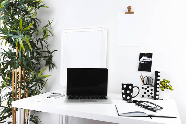 Invest in an L-shaped desk with file storage drawers and LED lighting